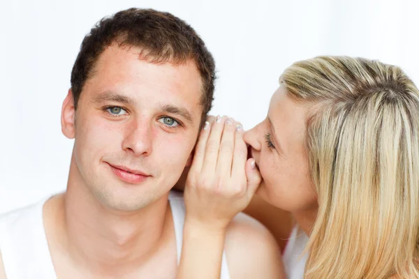 Woman whispering a man something important — Stock Photo, Image