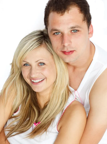 Happy couple sitting together and looking at the camera — Stock Photo, Image