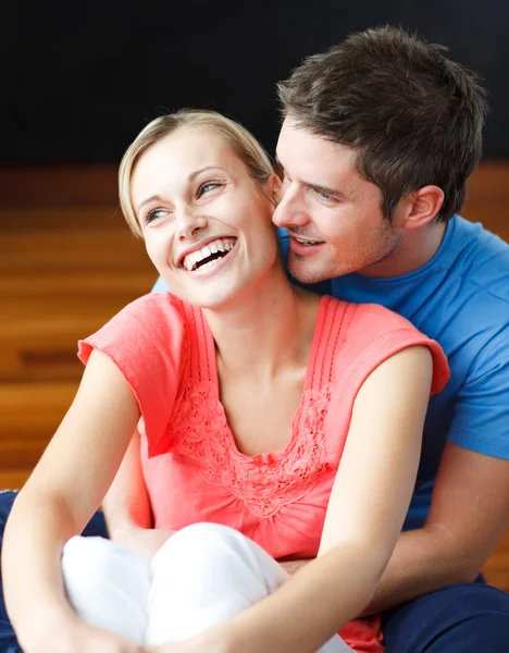 Couple sitting on the floor of their new apartment — Stock Photo, Image