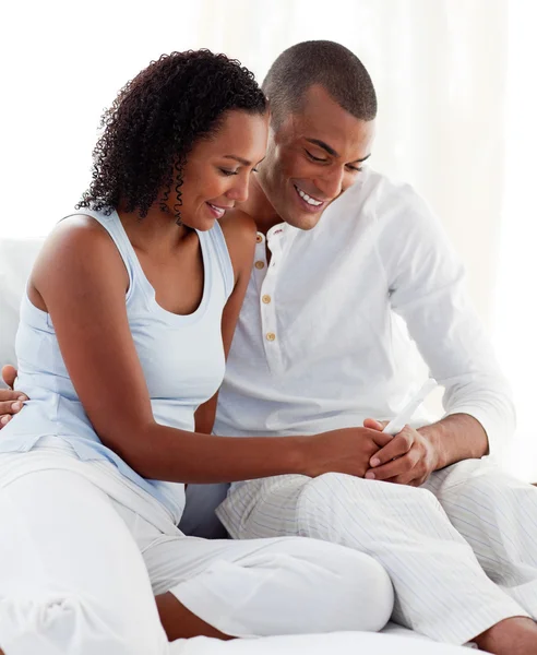 Afro-american couple finding out results of a pregnancy test — Stock Photo, Image