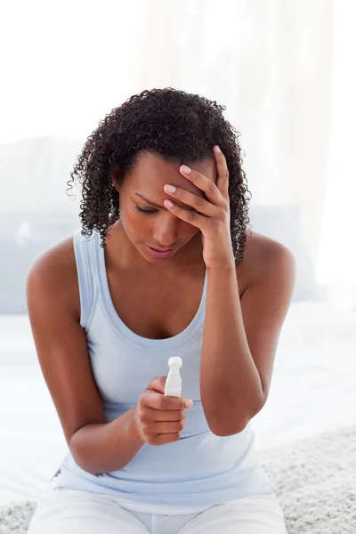 Upset woman finding out results of a pregnancy test — Stock Photo, Image