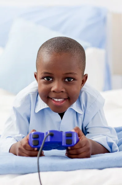 Cute little boy playing video game — Stok fotoğraf