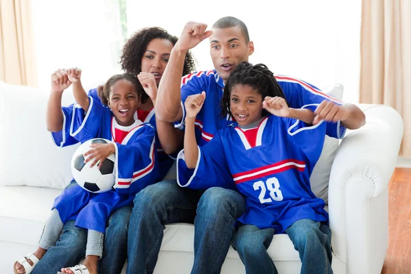 stock image Afro-American family celebrating a goal at home