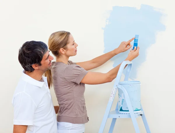 Happy couple painting together — Stock Photo, Image