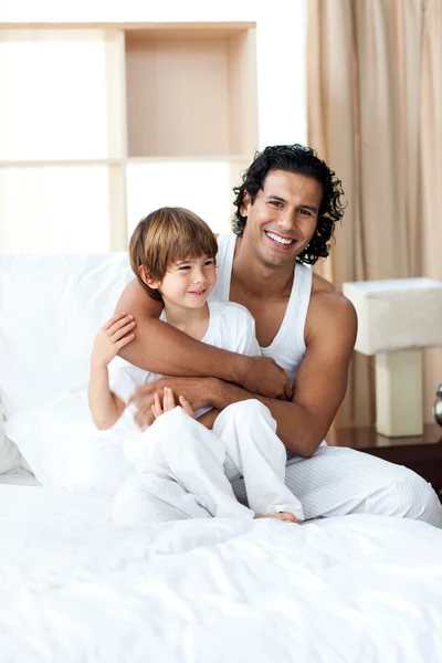 Smiling father hugging his son — Stock Photo, Image