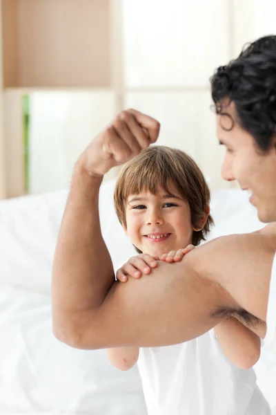 Happy child playing with his dad — Stock Photo, Image