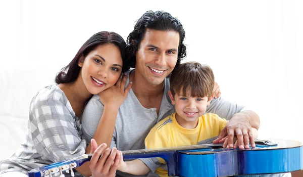 Caring parents playing guitar with their son — Stock Photo, Image