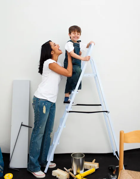 Adorable little boy climbing a ladder — Stock Photo, Image