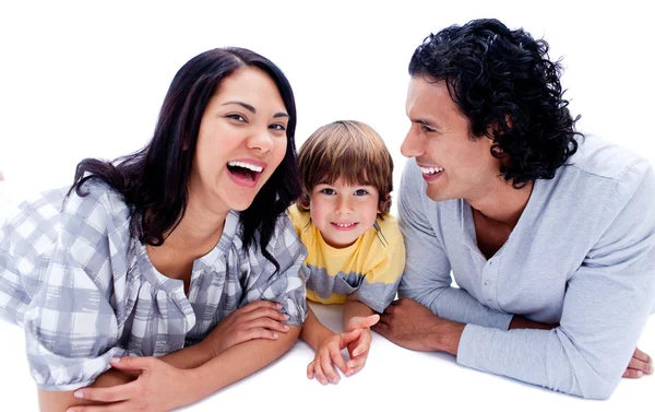 Laughing parents with their son lying on the floor — Stock Photo, Image