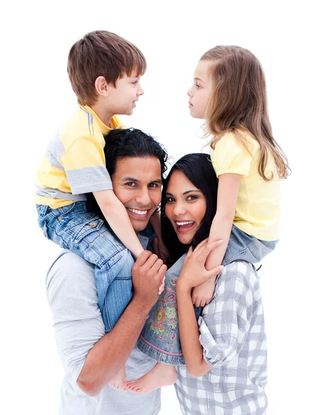 Smiling parents giving piggyback ride to their children — Stock Photo, Image