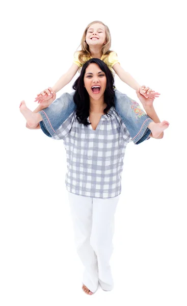Laughing mother giving piggyback ride to her daughter — Stock Photo, Image