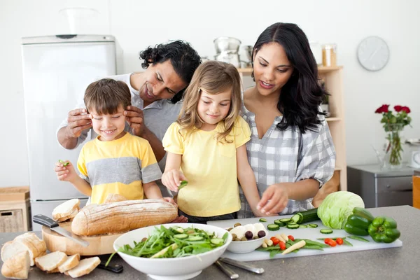 Jolly family preparing lunch together — Stock Photo, Image