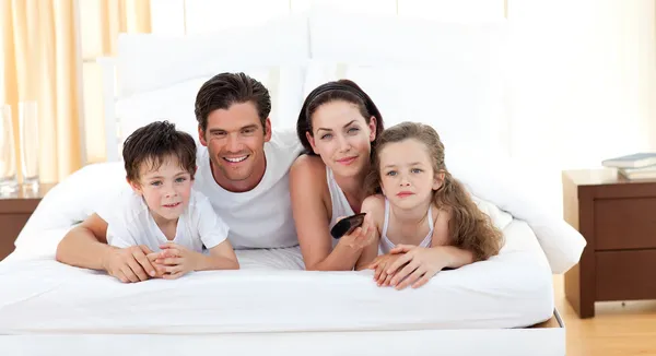 Cute siblings and their parents — Stock Photo, Image