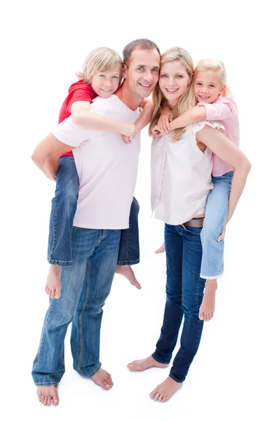 Attentive parents giving their children piggyback ride — Stock Photo, Image