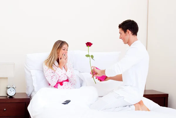 Affectionate husband giving a present to his wife — Stock Photo, Image