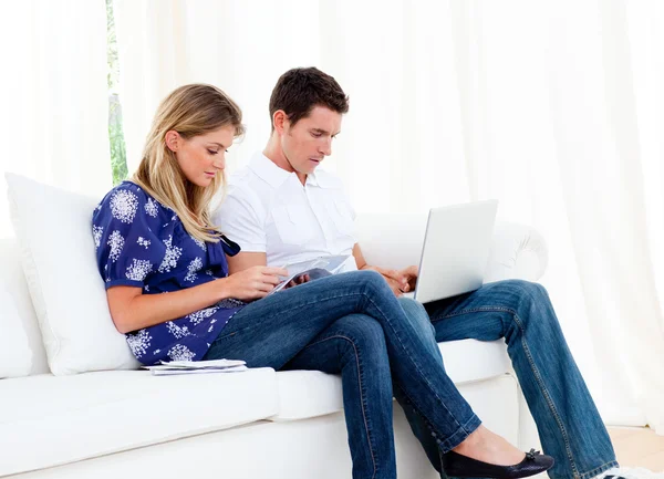Young couple working at home — Stock Photo, Image