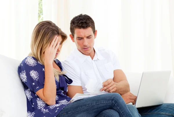 Distressed couple angry with so many bills to pay — Stock Photo, Image