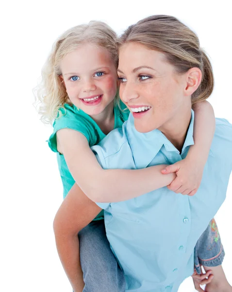 Caucasian mother giving her daughter piggyback ride — Stock Photo, Image
