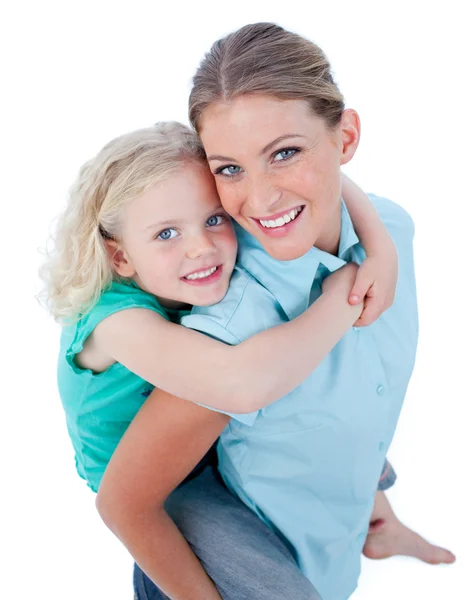 Blond mother giving her daughter piggyback ride — Stock Photo, Image