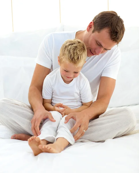 Attentive dad hugging his son — Stock Photo, Image