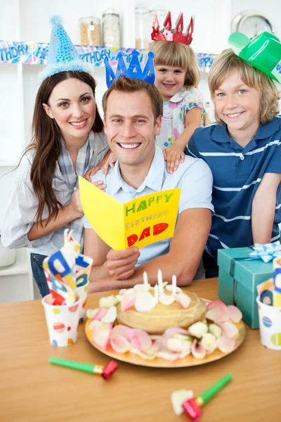 Jolly family celebrating father's birthday — Stock Photo, Image