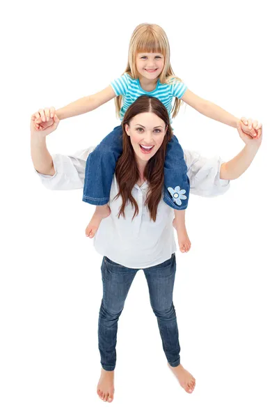 Beautiful mother giving her daughter piggyback ride — Stock Photo, Image