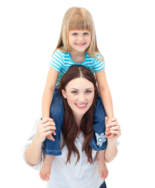 Attractive brunette mother giving her daughter piggyback ride — Stock Photo, Image