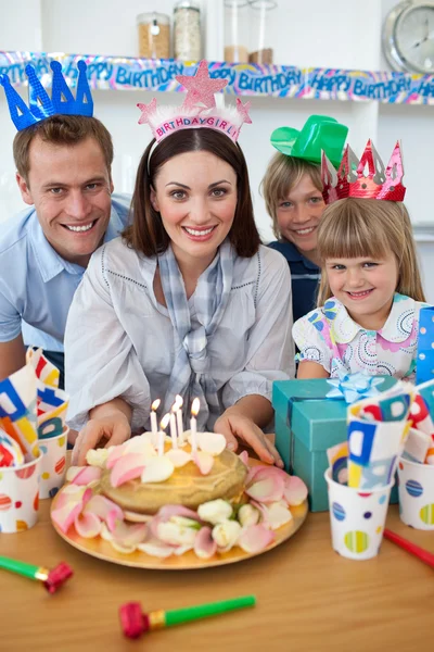 Cheerful family celebrating mother's birthday — Stock Photo, Image