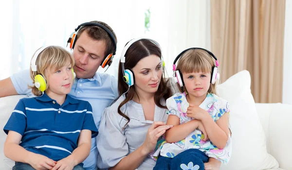 Young family listening music together — Stock Photo, Image