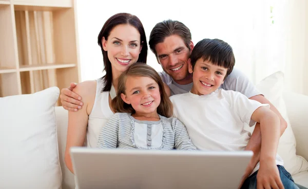 Happy family surfing the internet — Stock Photo, Image