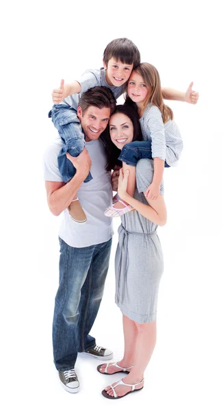 Jolly parents giving their children piggyback ride — Stock Photo, Image
