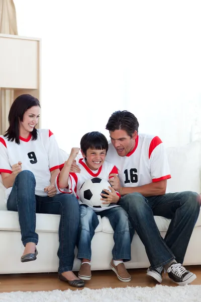 Excited family celebrating a goal — Stock Photo, Image
