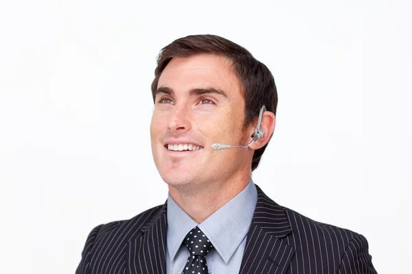 Retrato de um homem de negócios com um fone de ouvido isolado em branco — Fotografia de Stock