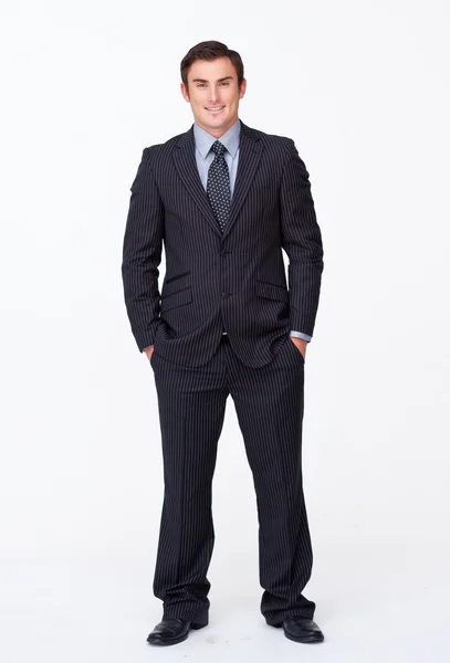 Smiling businessman with his hands in his pockets — Stock Photo, Image
