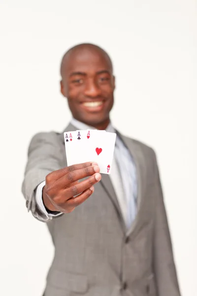 Attractive Afro-American businessman holding four aces — Stock Photo, Image