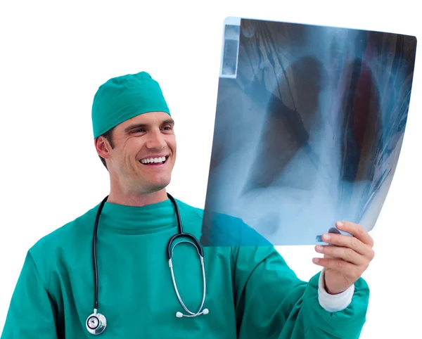 Enthusiastic surgeon looking at X-ray in his office — Stock Photo, Image