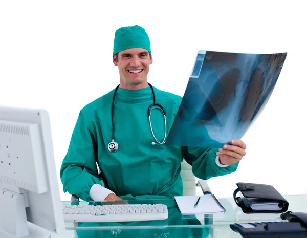 stock image Young surgeon looking at X-ray