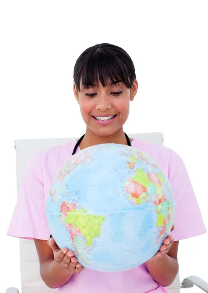 stock image Portrait of a beautiful female doctor holding a terrestrial glob