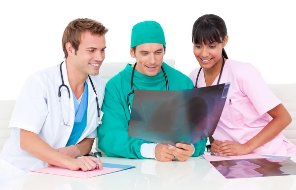 Positive medical team looking at X-ray — Stock Photo, Image