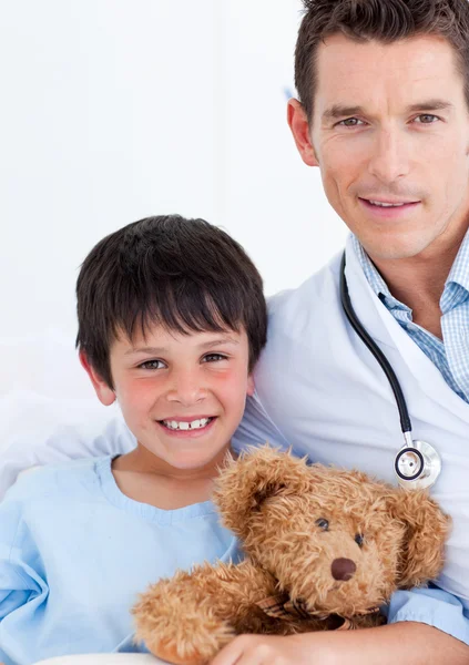 Portrait of a cute little boy and his doctor — Stock Photo, Image