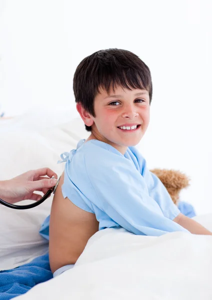 Portrait of a confident little boy examined by a doctor — Stock Photo, Image
