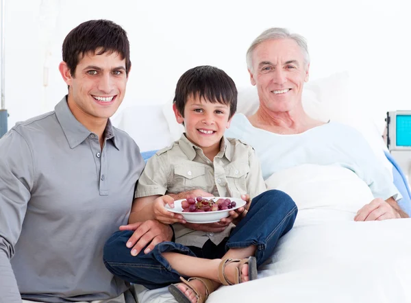 Father and son visiting grandfather — Stock Photo, Image