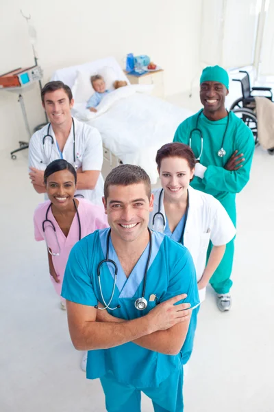 High angle of medical team with a child patient — Stock Photo, Image