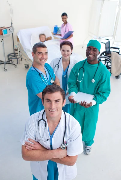 High view of medical team with a child in bed — Stock Photo, Image