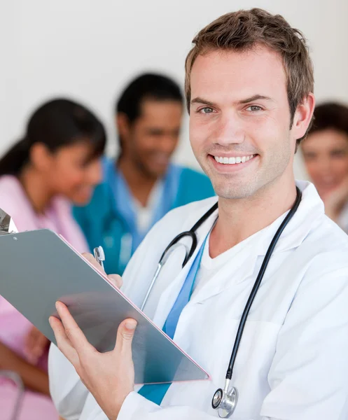 Young male Doctor Smiling at the camera — Stock Photo, Image