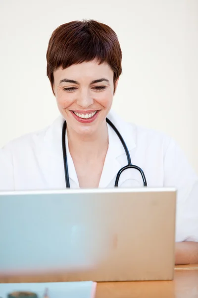 Doctor sitting at desk in Hospital — Stock Photo, Image