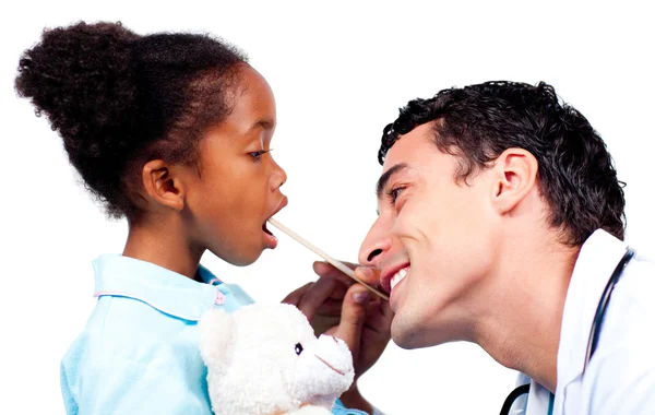 Young doctor checking little girl's throat — Stock Photo, Image