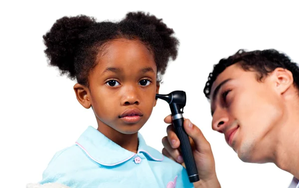 Concentrated doctor examining his young patient — Stock Photo, Image