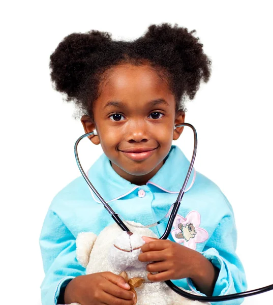 Cute little girl playing with a stethoscope — Stock Photo, Image