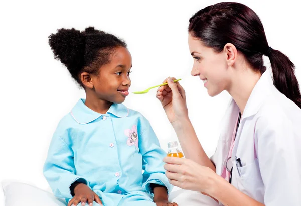 Adorable little girl taking medicine — Stock Photo, Image